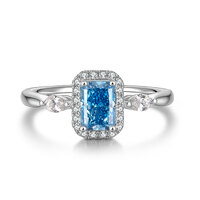 0.72 ct Radiant Cut Natural Blue Diamond Ring | 950 Platinum | Pear-Shaped Accents & Diamond Halo