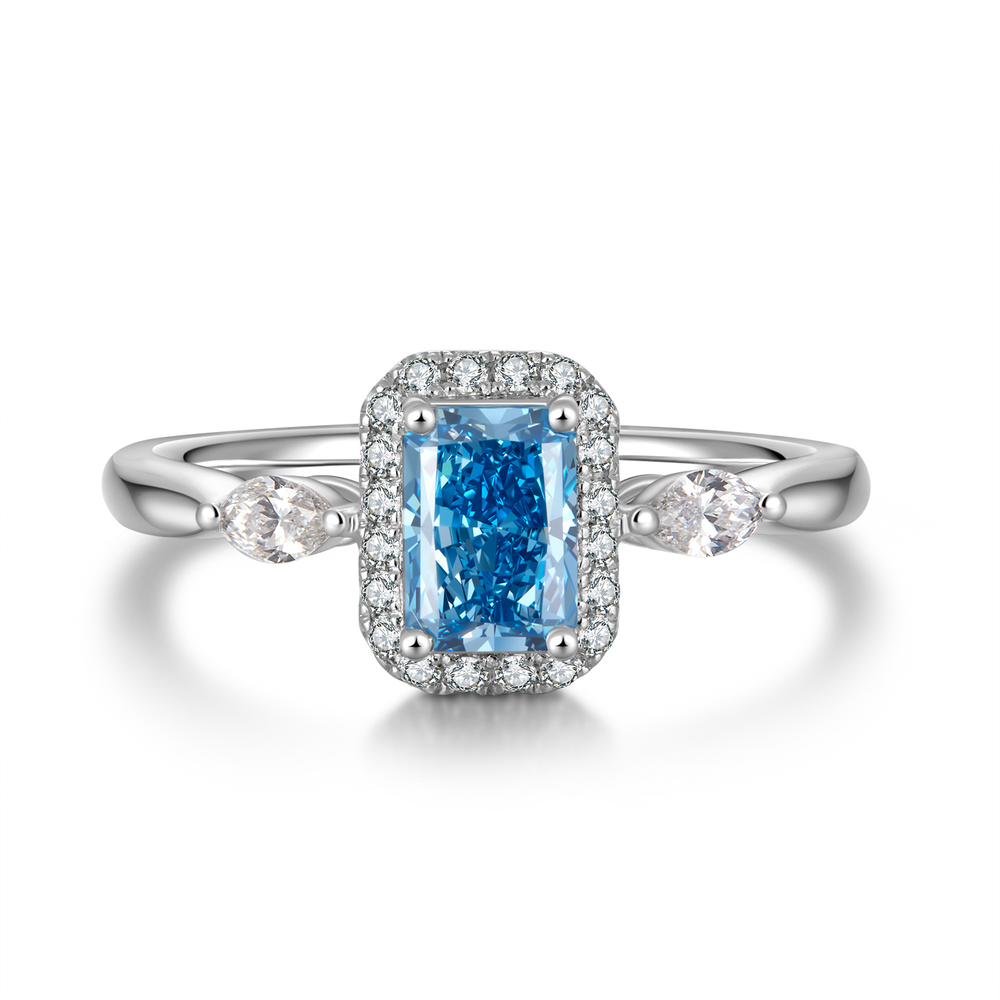 0.72 ct Radiant Cut Natural Blue Diamond Ring | 950 Platinum | Pear-Shaped Accents & Diamond Halo