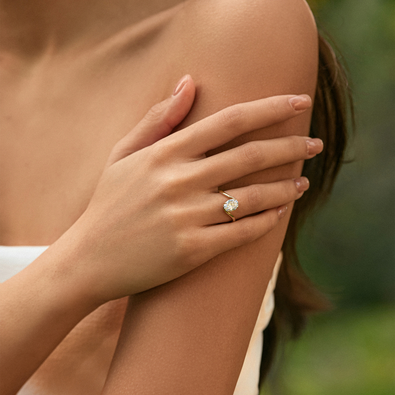 Timeless Brilliance · 18K Gold Oval Diamond Ring with Twisted Shank