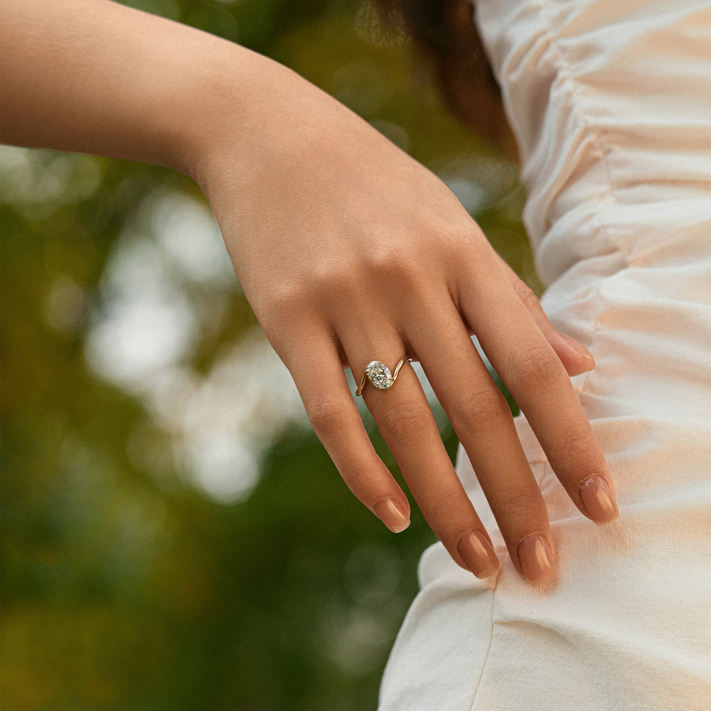 Timeless Brilliance · 18K Yellow Gold Oval Diamond Ring with Twisted Shank