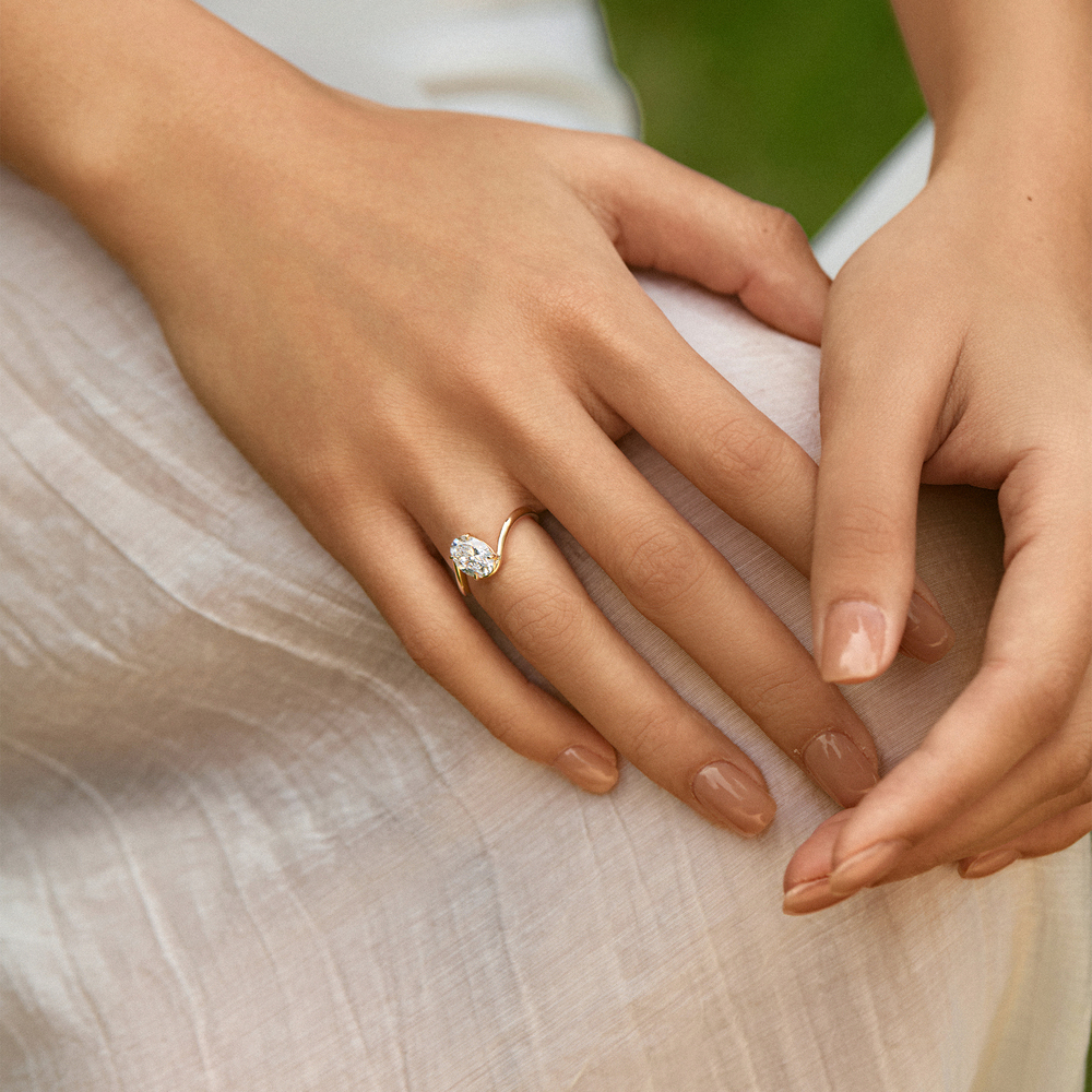 Timeless Brilliance · 18K Yellow Gold Oval Diamond Ring with Twisted Shank
