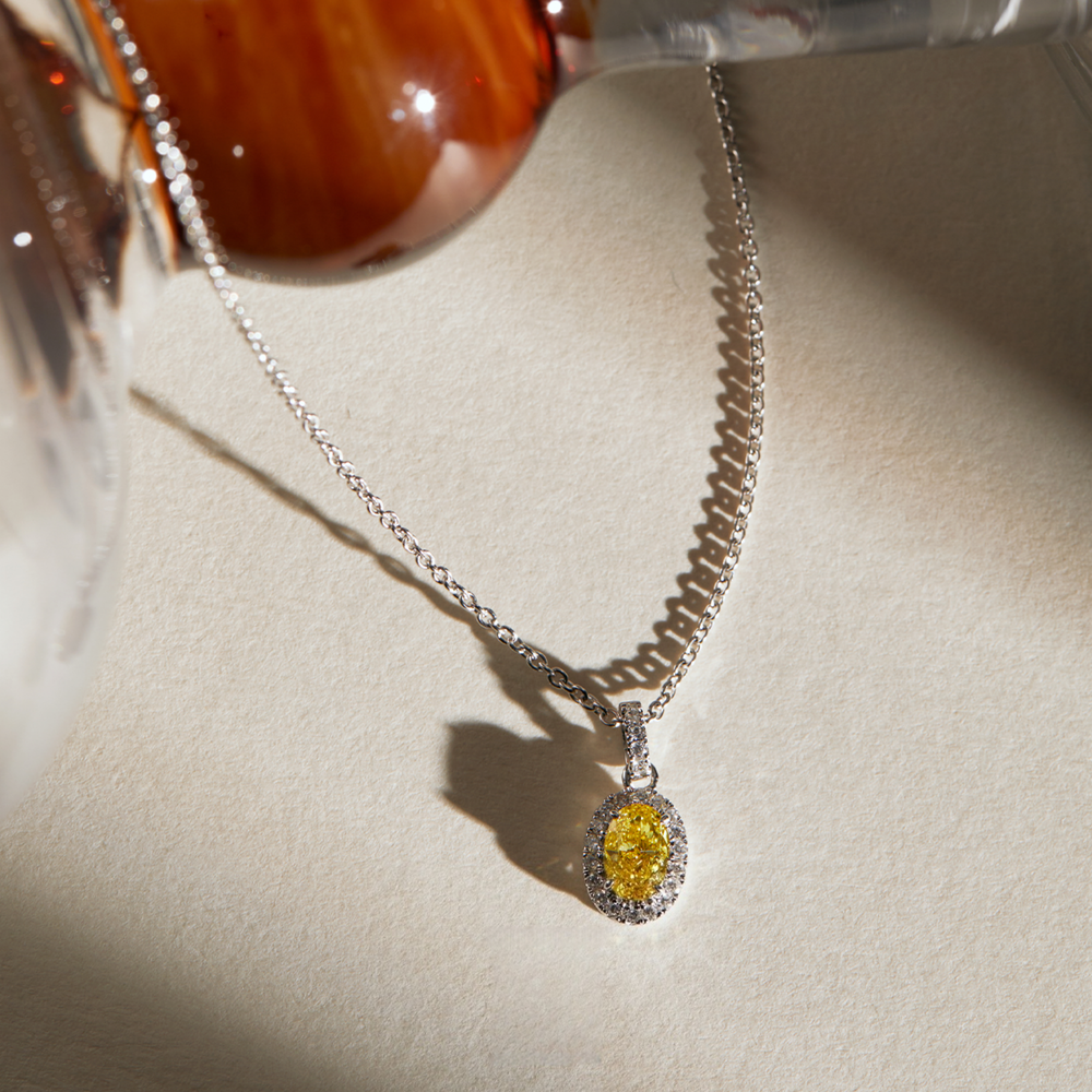Oval Yellow Diamond Halo Necklace in 950 Platinum (0.44 ct. tw.)